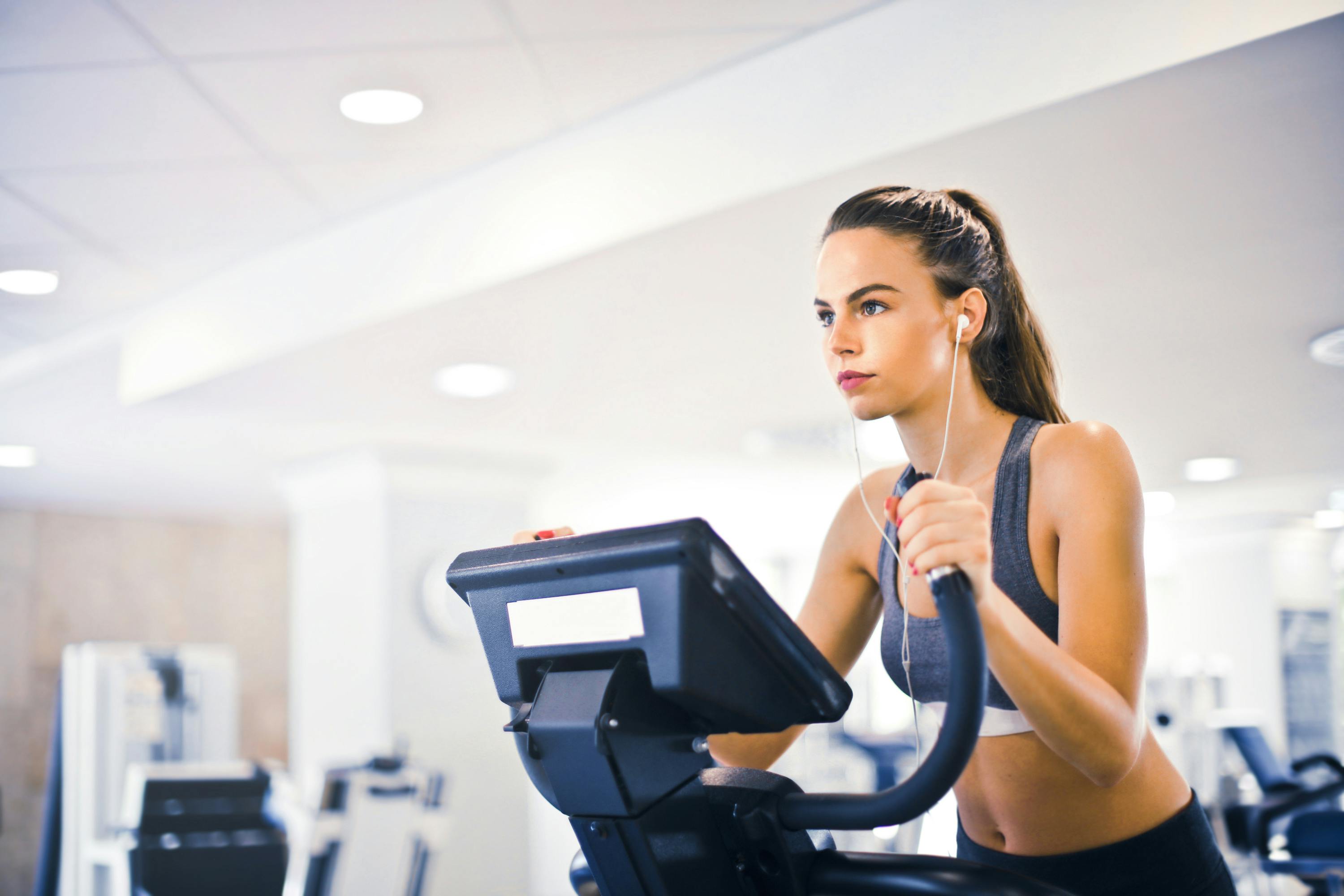 Senior man exercising on a recumbent exercise bike for low-impact cardio — AllCare Store