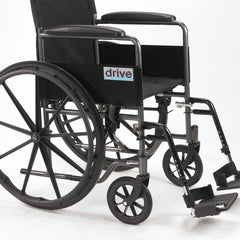 wheelchair 18-inch seat width side view with full arms and footrests