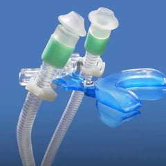 CPAP Pro II No-Mask System showing the blue bite-wing mouthpiece connected to adjustable nasal puffs and clear air tubes