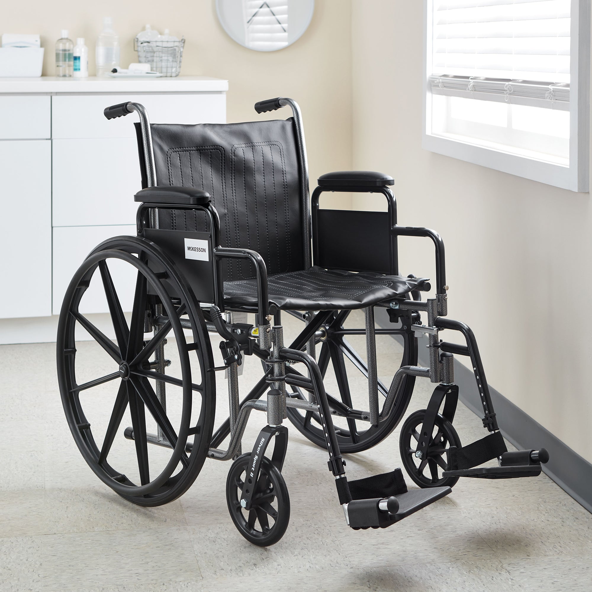 Lightweight Wheelchair McKesson Dual Axle Desk Length Arm Swing-Away Elevating Legrest Black Upholstery 18 Inch Seat Width Adult 300 lbs. Weight Capacity, Packaging Type- Each