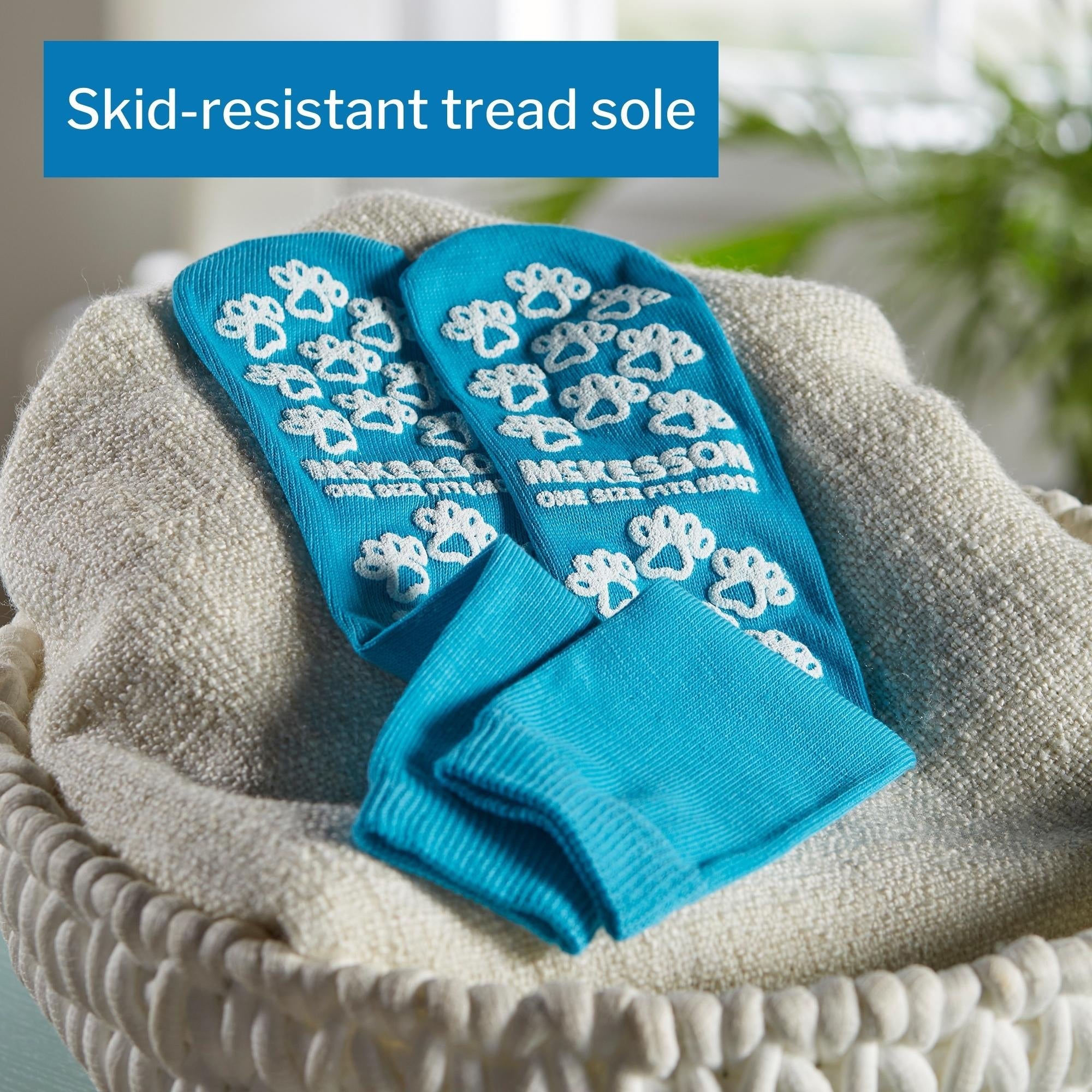 Slipper Socks McKesson Paw Prints Unisex Adult One Size Fits Most Single Tread Single Patient Use Teal, Packaging Type- Case