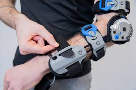 Post-Op Elbow Brace Rebound One Size Fits Most D-Ring / Hook and Loop Strap Closure Right Arm Black / Blue / Gray, Packaging Type- Each