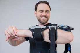 Post-Op Elbow Brace Rebound One Size Fits Most D-Ring / Hook and Loop Strap Closure Left Arm Black / Blue / Gray, Packaging Type- Each