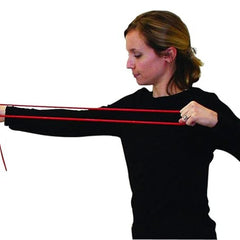 Woman stretching red CanDo exercise tubing, Red Light